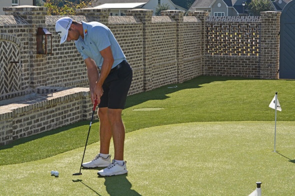 Naperville Golfer putting on synthetic grass